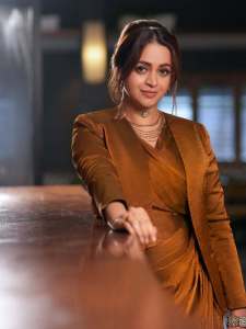 bhavana-actress-in-rich-mustard-brown-symmetrical-tulip-style-draped-dhoti-skirt-dress-photos-002