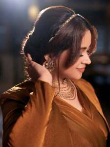 bhavana-actress-in-rich-mustard-brown-symmetrical-tulip-style-draped-dhoti-skirt-dress-photos-006
