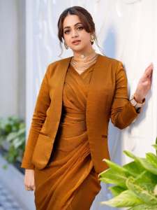 bhavana-actress-in-rich-mustard-brown-symmetrical-tulip-style-draped-dhoti-skirt-dress-photos-013