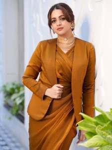 bhavana-actress-in-rich-mustard-brown-symmetrical-tulip-style-draped-dhoti-skirt-dress-photos-017