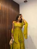 devika-sanjay-in-Sleeveless-sweetheart-neckline-tunic-in-a-vibrant-olive-green-kurti-with-Matching-flared-sharara-pants-in-a-satin-finish-fabric-photos-001