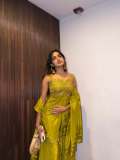 devika-sanjay-in-Sleeveless-sweetheart-neckline-tunic-in-a-vibrant-olive-green-kurti-with-Matching-flared-sharara-pants-in-a-satin-finish-fabric-photos-002