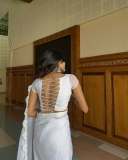 devika-sanjay-in-sheer-fluid-white-saree-likely-organza-or-tissue-chiffon-featuring-a-fine-white-lace-border-along-the-edges-with-same-colour-blouse-photos-003