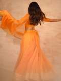 devika-sanjay-in-twirling-vivid-marigold-orange-lehenga-skirt-paired-with-a-matching-sheer-organza-dupatta-bordered-with-delicate-gold-lace-photos-007