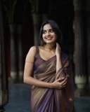 devika-sanjay-in-violet-tissue-saree-photos-009