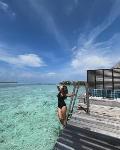 esther-anil-in-black-swimsuit-dress-photos-002