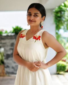esther-anil-in-off-white-pure-mul-cotton-Vaaka-flower-embroidered-A-line-flared-onam-dress