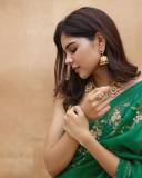 celebrity-kalyani-priyadarshan-in-dark-green-saree-with-green-blouse-005