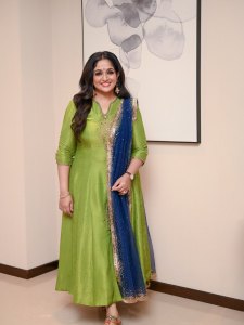 kavya-madhavan-in-floor-length-flared-lime-green-Anarkali-suit-with-a-V-cut-neckline-adorned-with-delicate-embroidery-at-the-chest-photos