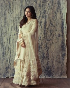 kayadu-lohar-in-Muted-ivory-off-white-and-pale-gold-tones-Elegant-ethnic-Sharara-and-softly-defined-eyes-with-thin-black-eyeliner-and-nude-pink-satin-lipstick-004
