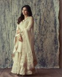 kayadu-lohar-in-Muted-ivory-off-white-and-pale-gold-tones-Elegant-ethnic-Sharara-and-softly-defined-eyes-with-thin-black-eyeliner-and-nude-pink-satin-lipstick-004