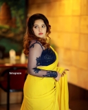 malavika-menon-in-yellow-saree-with-black-blouse-photos-001