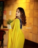 malavika-menon-in-yellow-saree-with-black-blouse-photos-003