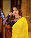 malavika-menon-in-yellow-saree-with-black-blouse-photos-006
