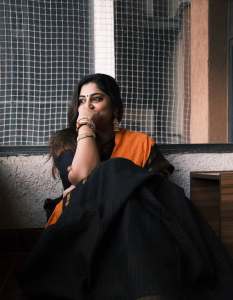 manjima-mohan-in-black-and-orange-saree-style-images-002