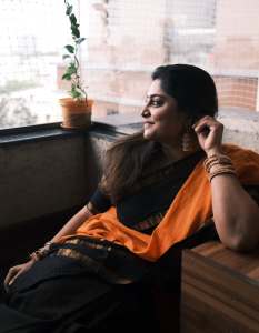 manjima-mohan-in-black-and-orange-saree-style-images-004