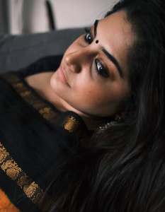 manjima-mohan-in-black-and-orange-saree-style-images-006
