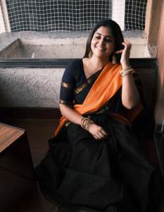 manjima-mohan-in-black-and-orange-saree-style-images
