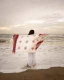 manjima-mohan-in-A-clean-minimal-all-white-solid-co-ord-set-featuring-a-long-sleeved-mid-length-tunic-kurta-with-matching-loose-fit-white-trousers-and-bold-red-and-black-shawl-003