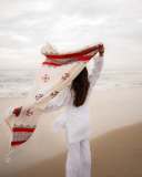 manjima-mohan-in-A-clean-minimal-all-white-solid-co-ord-set-featuring-a-long-sleeved-mid-length-tunic-kurta-with-matching-loose-fit-white-trousers-and-bold-red-and-black-shawl-005