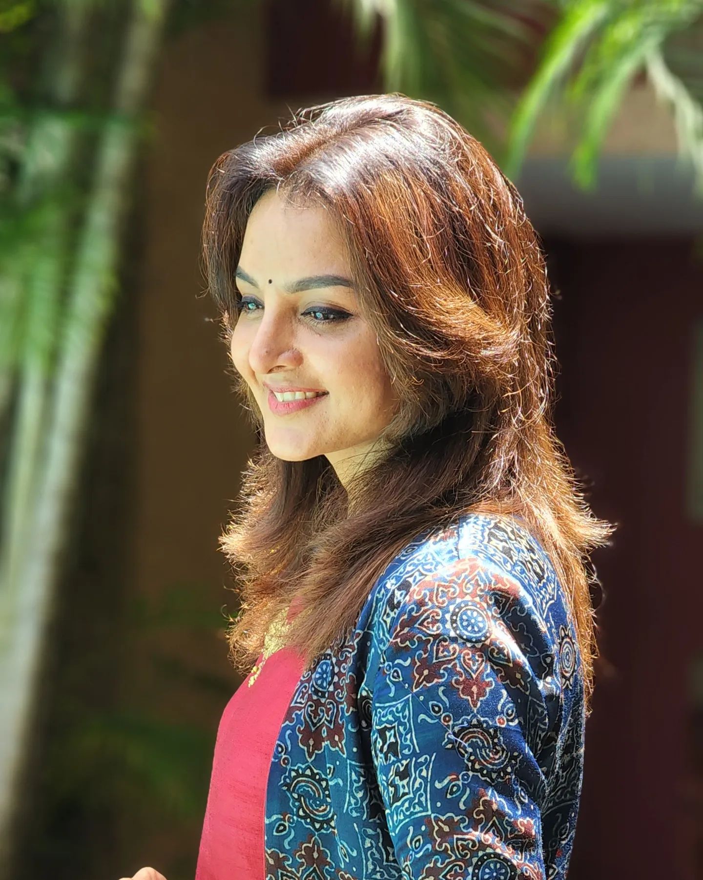 manju-warrier-in-red-colour-outfit-with-jacket-003