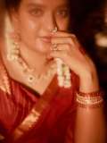 mareena-michael-kurisingal-in-red-saree-traditional-style-images-006