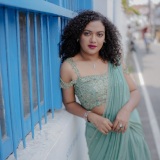 mareena-michael-kurisingal-in-sky-colour-party-wear-saree-with-styling-look-photos