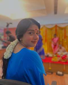 meera-jasmine-in-blue-dress-with-jasmine-flower-photo