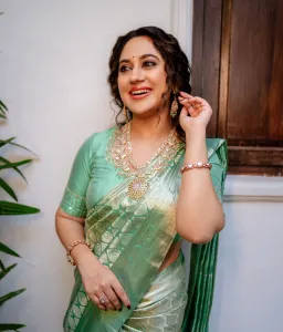 miya-george-in-pista-green-colour-pattu-saree-photos-002