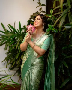 miya-george-in-pista-green-colour-pattu-saree-photos-006