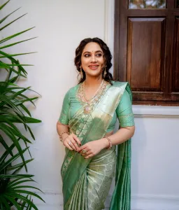 miya-george-in-pista-green-colour-pattu-saree-photos