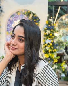 namitha-pramod-in-black-strips-in-wrap-midi-dress-photos-005