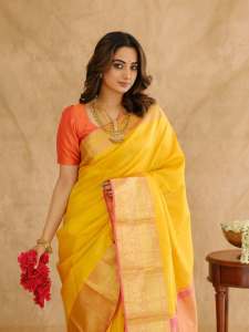 namitha-pramod-in-bright-sunny-yellow-silk-saree-with-contrasting-solid-coral-orange-silk-blouse-with-plain-short-sleeves-and-a-scoop-neck-002