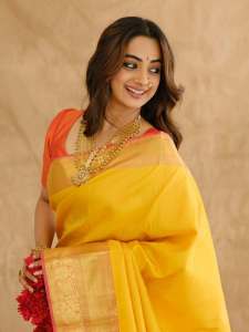 namitha-pramod-in-bright-sunny-yellow-silk-saree-with-contrasting-solid-coral-orange-silk-blouse-with-plain-short-sleeves-and-a-scoop-neck