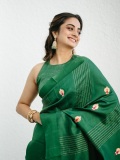 namitha-pramod-in-rich-emerald-green-fabric-with-a-subtle-sheen-characteristic-of-fine-silk-saree-Paired-with-a-matching-sleeveless-round-neck-blouse-photos-005