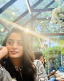 namitha-pramod-in-black-strips-in-wrap-midi-dress-photos-003