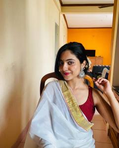 nandana-varma-in-red-blouse-and-set-saree-combo-for-vishu-002