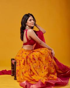 nandana-varma-in-sleeveless-blouse-yellow-lehenga-002
