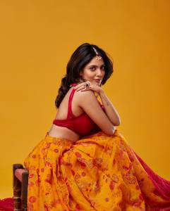 nandana-varma-in-sleeveless-blouse-yellow-lehenga