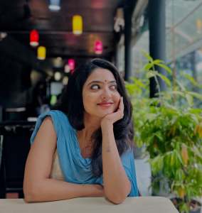 nandana-varma-in-white-sleeveless-churidar-with-sky-blue-dupatta-photos-001