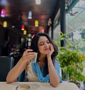 nandana-varma-in-white-sleeveless-churidar-with-sky-blue-dupatta-photos