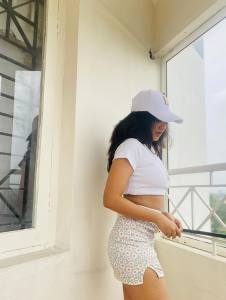 nandana-varma-white-outfit-with-white-cap-style-photos-001