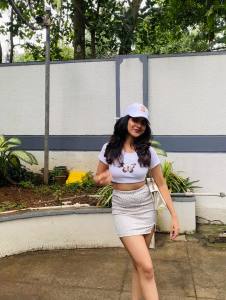 nandana-varma-white-outfit-with-white-cap-style-photos-003