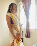 nandana-varma-in-red-blouse-and-set-saree-combo-for-vishu