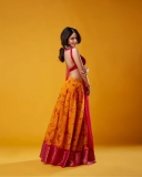 nandana-varma-in-sleeveless-blouse-yellow-lehenga