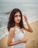 nandana-varma-latest-photos-in-white-colour-gown-with-horse-004