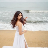 nandana-varma-latest-photos-in-white-colour-gown-with-horse