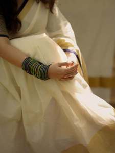 nikhila-vimal-in-check-printed-blouse-for-kerala-saree-pics-004
