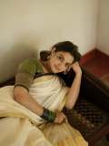 nikhila-vimal-in-check-printed-blouse-for-kerala-saree-pics-001