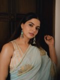 nikhila-vimal-in-lightweight-pastel-aqua-saree-with-sleeveless-V-neck-fitted-blouse-photos-001
